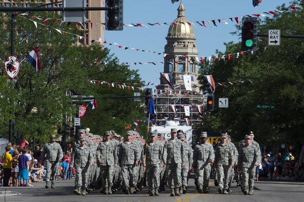 Ninetieth Missile Wing Airmen march in a flight down Central Avenue in Cheyenne, Wyo., July 23, 2016, during the 120th Cheyenne Frontier Days opening grand parade. F.E. Warren Airmen volunteer in many capacities during CFD, Cheyenne's biggest annual event. (U.S. Air Force photo by Staff Sgt. Christopher Ruano)