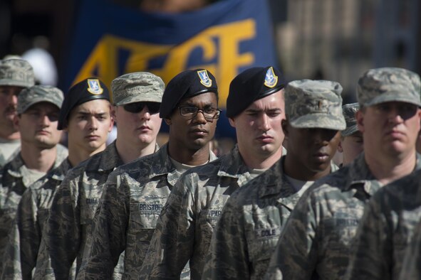 Airmen from the 90th Missile Wing march in a flight down Central Avenue in Cheyenne, Wyo., July 23, 2016, during the 120th Cheyenne Frontier Days opening grand parade. Airmen from the base volunteer in many capacities during CFD, Cheyenne's biggest annual event. (U.S. Air Force photo by Senior Airman Jason Wiese)