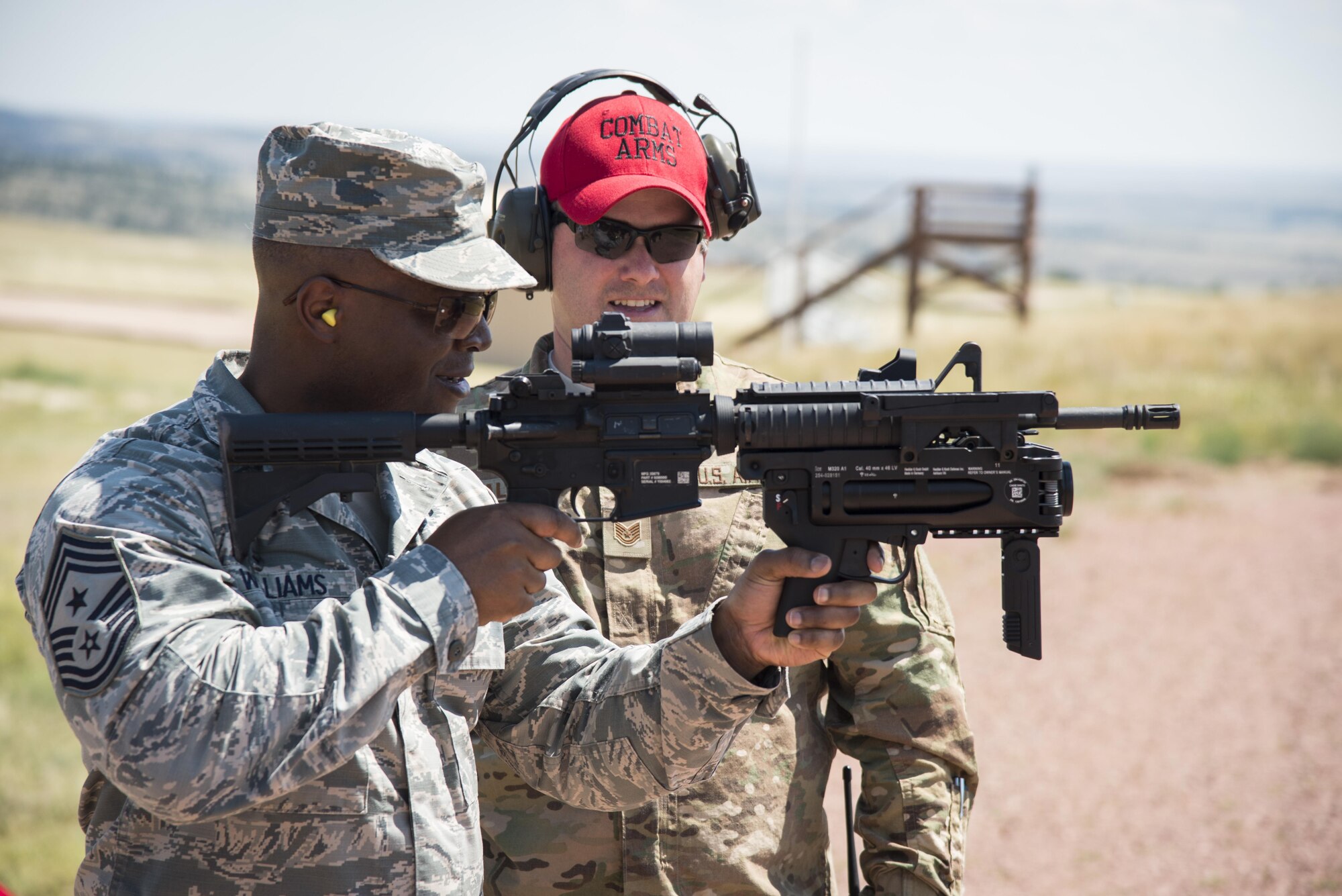 Chief Master Sgt. Calvin Williams, AFGSC command chief, fires a grenade launcher at the 620th Ground Combat Training Squadron at Camp Guernsey, Wyo., July 21, 2016. During the visit, Williams tested and reviewed weapons used by security forces personnel. (U.S. Air Force photo by Senior Airman Malcolm Mayfield)