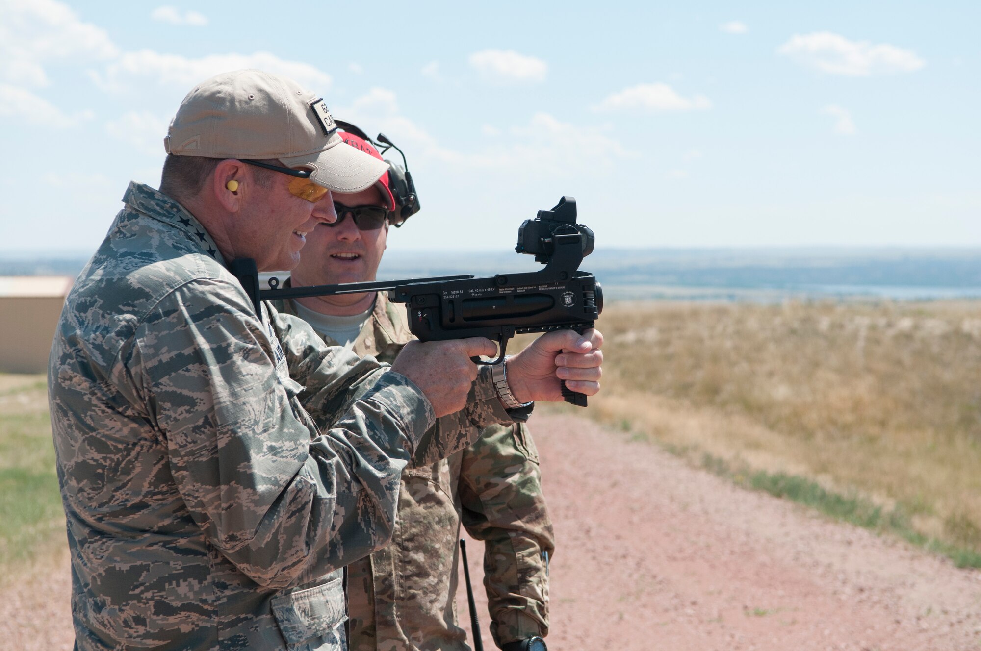 Gen. Robin Rand, AFGSC commander, fires a grenade launcher, during his visit with the 620th Ground Combat Training Squadron at Camp Guernsey, Wyo., July 21, 2016. Security Forces Airmen in AFGSC train at Camp Guernsey to maintain and enhance their proficiency in securing nuclear assets. (U.S. Air Force photo by Senior Airman Malcolm Mayfield)