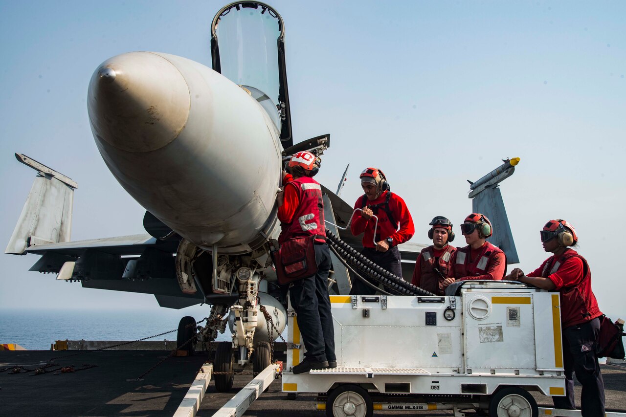 Aviation Ordnancemen load ordnance into an F/A-18E Super Hornet assigned to the Gunslingers of Strike Fighter Squadron (VFA) 105 on the flight deck of the aircraft carrier USS Dwight D. Eisenhower (CVN 69) in preparation for a mission in support of Operation Inherent Resolve. Dwight D. Eisenhower and its carrier strike group are deployed in support of Operation Inherent Resolve, maritime security operations and theater security cooperation efforts in the U.S. 5th Fleet area of operations.