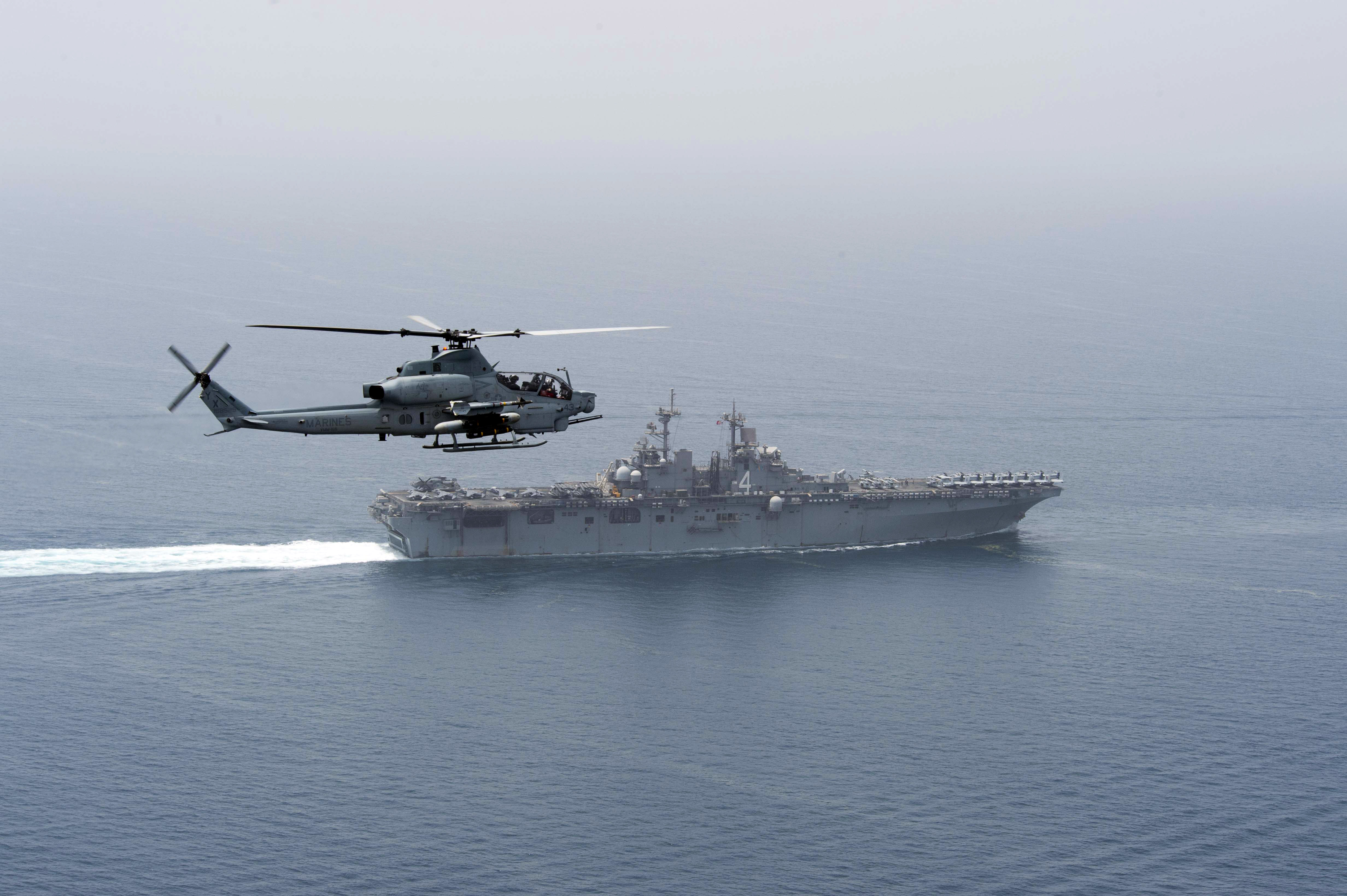 An AH-1Z Viper helicopter, assigned to the 13th Marine Expeditionary Unit (MEU), patrols waters near the amphibious assault ship USS Boxer (LHD 4). Boxer is the flagship for the Boxer Amphibious Ready Group and, with the embarked 13th MEU, is deployed in support of Operation Inherent Resolve, maritime security operations and theater cooperation efforts in the U.S. 5th Fleet area of operations. 