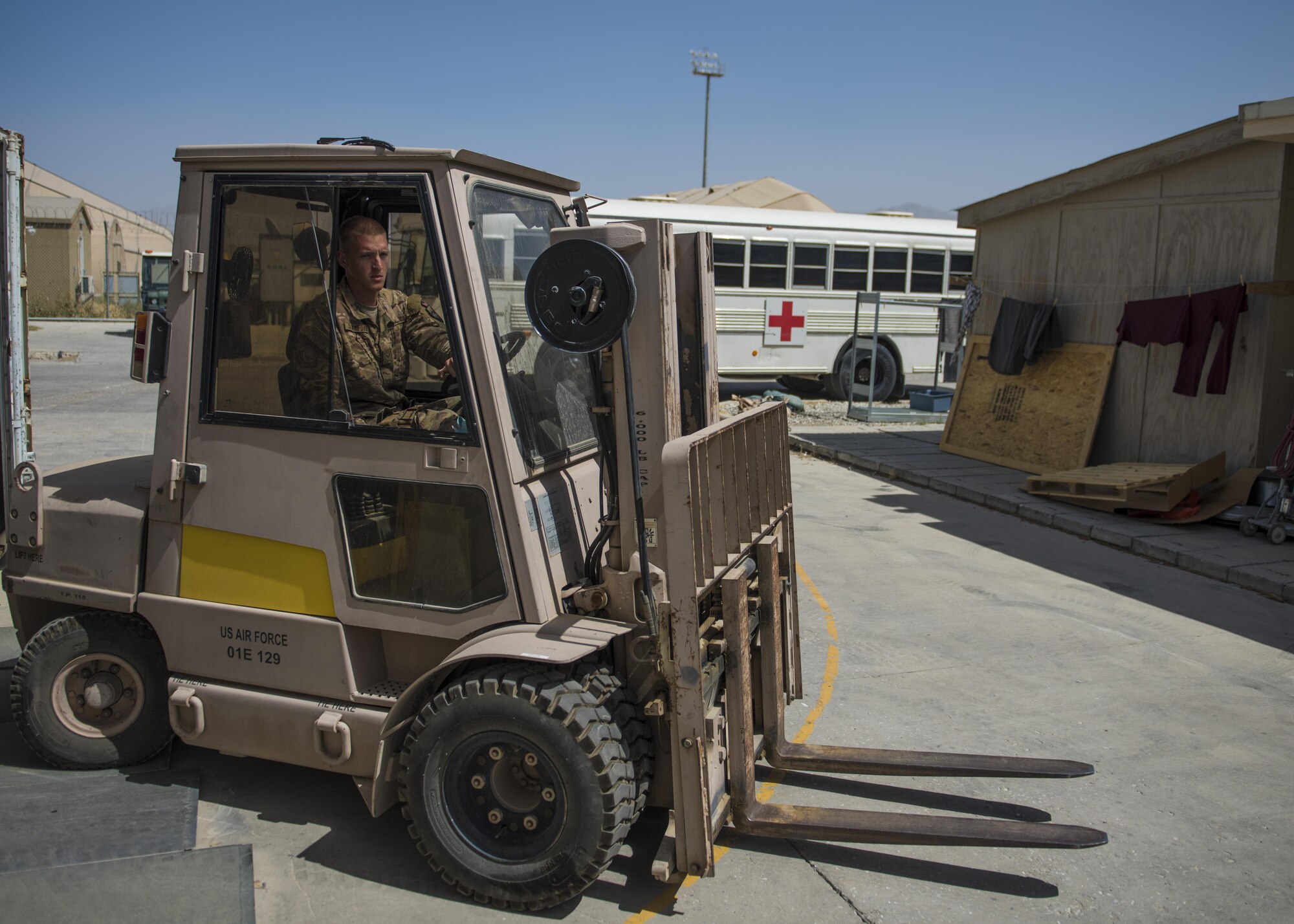 Senior Airman Chase Stanford, 455th Expeditionary Medical Group, medical logistics technician, moves a medical supply pallet, Bagram Airfield, Afghanistan, July 23, 2016. Logistics technicians receive, off load, inventory and deliver medical and non-medical supplies throughout the Joint-Craig Theater Hospital, ensuring the medical staff have the tools needed to provide care. (U.S. Air Force photo by Senior Airman Justyn M. Freeman)