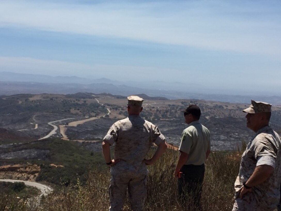 Brig. Gen. Kevin Killea, Commanding General, Marine Corps Installations - West / Marine Corps Base Camp Pendleton, and SgtMaj. Julio Meza, MCI-West / Marine Corps Base Camp Pendleton SgtMaj., tour Camp Pendleton with members of the U. S. Forestry Service during a brush fire, July 24, 2016. The fire, which began July 21, burned 1,454 acres aboard Camp Pendleton. Photo courtesy Col. Patrick Gramuglia.