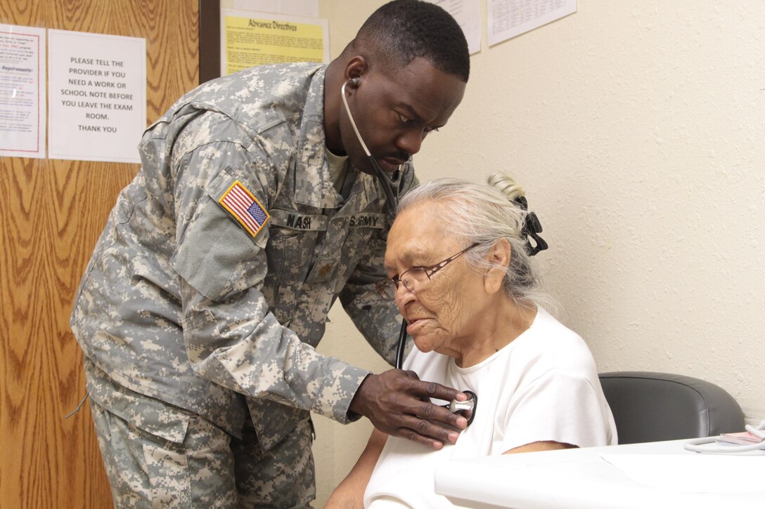 LOWER BRULE RESERVATION—Maj. Jerry Nash, a nurse practitioner with the Army Reserve’s 7242nd Medical Support Unit, examines a local elder at the Lower Brule Indian Health Center, located on Lower Brule, S.D. Nash visited the center during Innovative Readiness Training designed to employ critical skills in community outreach. (U.S. Army Reserve photo by Spc. David Alexander)
