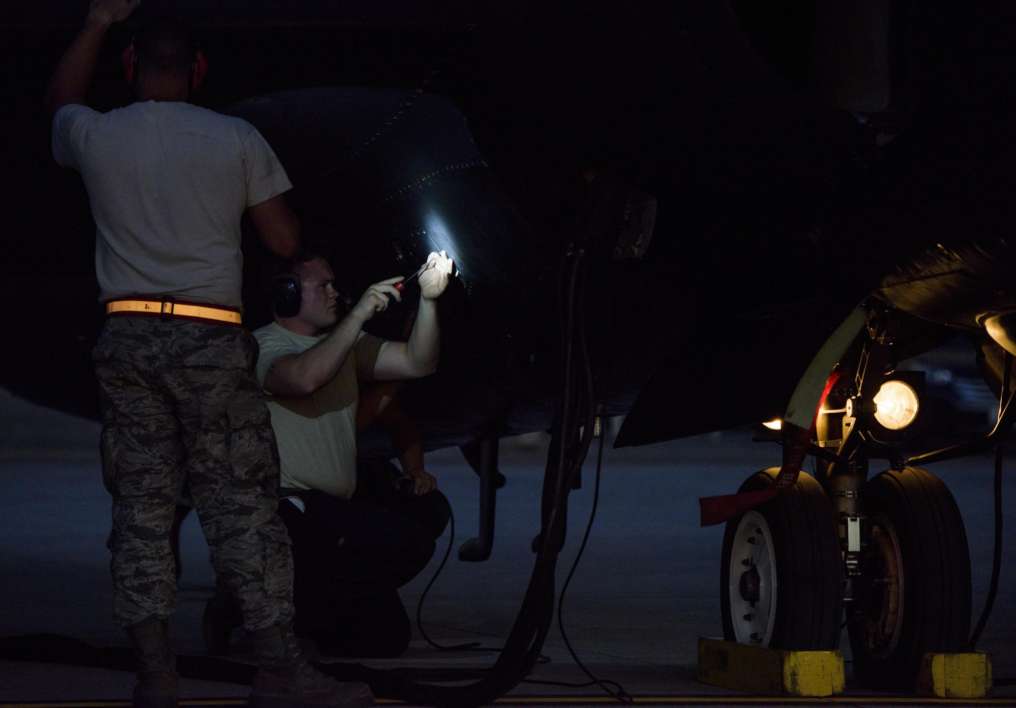 Airmen from Beale Air Force Base Cali, rush to prepare the U-2 for takeoff on Nellis Air Force Base, Nevada July 18, 2016 for Red Flag 16-3. This is the first time this decade the U-2 has flown in Red Flag while staging out of Nellis Air Force Base. (U.S. Air Force photo/Tech. Sgt. David Salanitri)