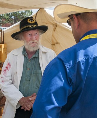 Dr. Doug Helgeson, American Civil War surgeon re-enactor, talks with Col. Stephen Kravitsky, 90th Missile Wing commander, July 23, 2016, during Fort D.A. Russell Days, the annual F.E. Warren Air Force Base, Wyo., open house. Helgeson and his group returned to the base’s open house after a four-year hiatus. (U.S. Air Force photo by Senior Airman Jason Wiese)