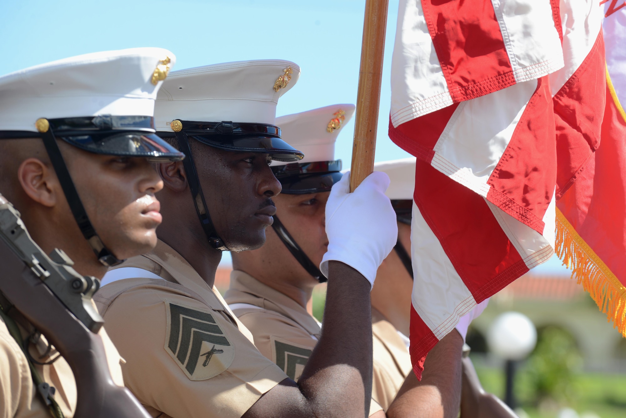 U.S. Marines assigned to 3rd Marine Division, III Marine Expeditionary Force color guard, march during the 72nd Guam Liberation Day parade July 21, 2016, in Hagåtña, Guam. Liberation Day is celebrated every year on July 21 to mark the day Guam was liberated from Japanese occupation during World War II, to remember the suffering and to honor the sacrifices made by all. (U.S. Air Force photo by Airman 1st Class Arielle Vasquez/Released)