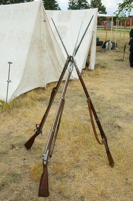American Civil War-era rifles stand leaning against each other July 23, 2016, during Fort D.A. Russell Days, the annual F.E. Warren Air Force Base, Wyo., open house. Visitors interacted with re-enactors who explained the tools and lifestyle of soldiers and civilians in the time period. (U.S. Air Force photo by Senior Airman Jason Wiese)