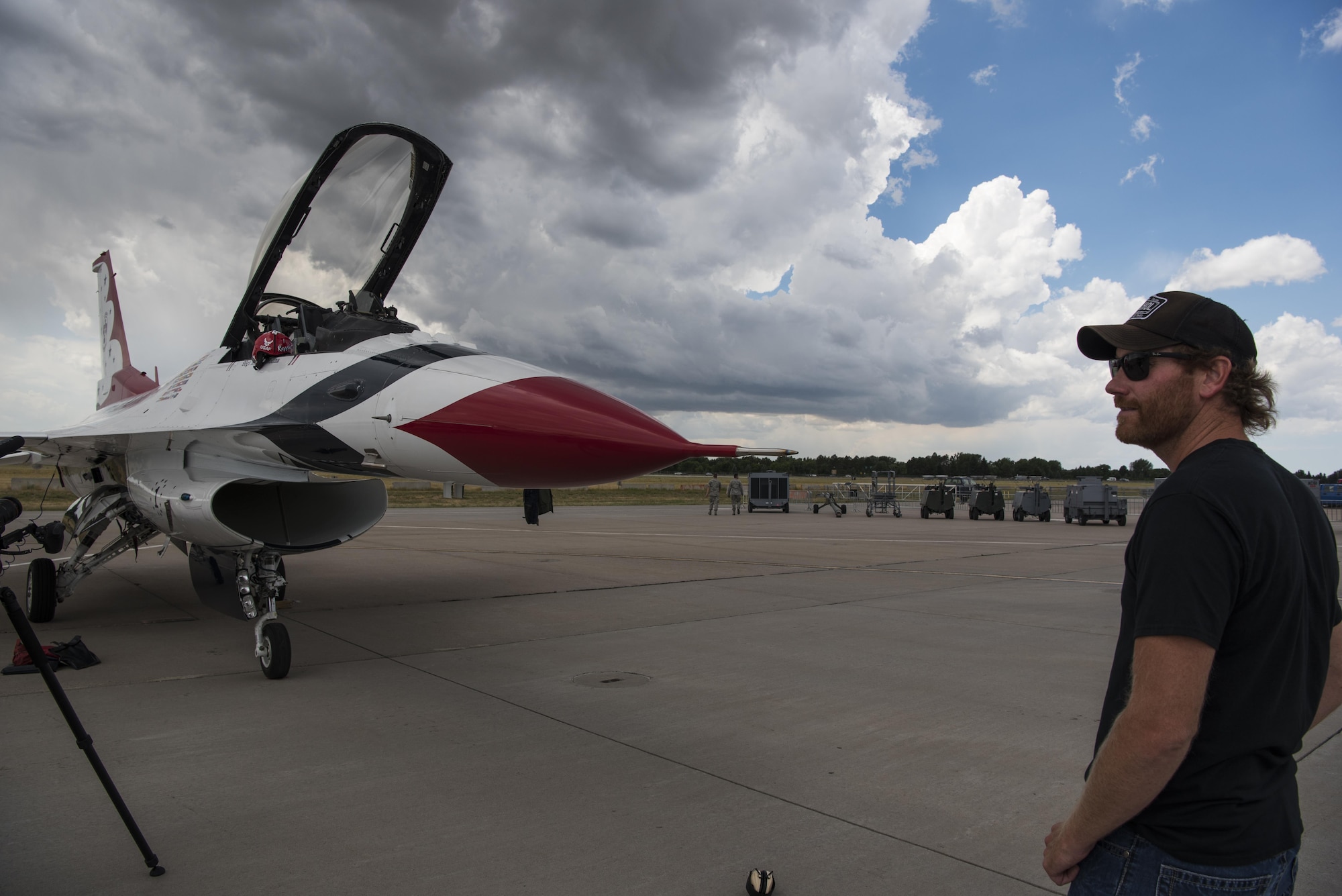 Chancey Williams looks on at the U.S. Air Force Thunderbirds F-16 Fighting Falcon fighter aircraft before his flight July 24, 2016, on the Wyoming Air National Guard Base, Cheyenne, Wyo. Williams is an American country music singer-songwriter and a former saddle-bronco rider from Wyoming. (U.S. Air Force photo by Staff Sgt. Christopher Ruano)

