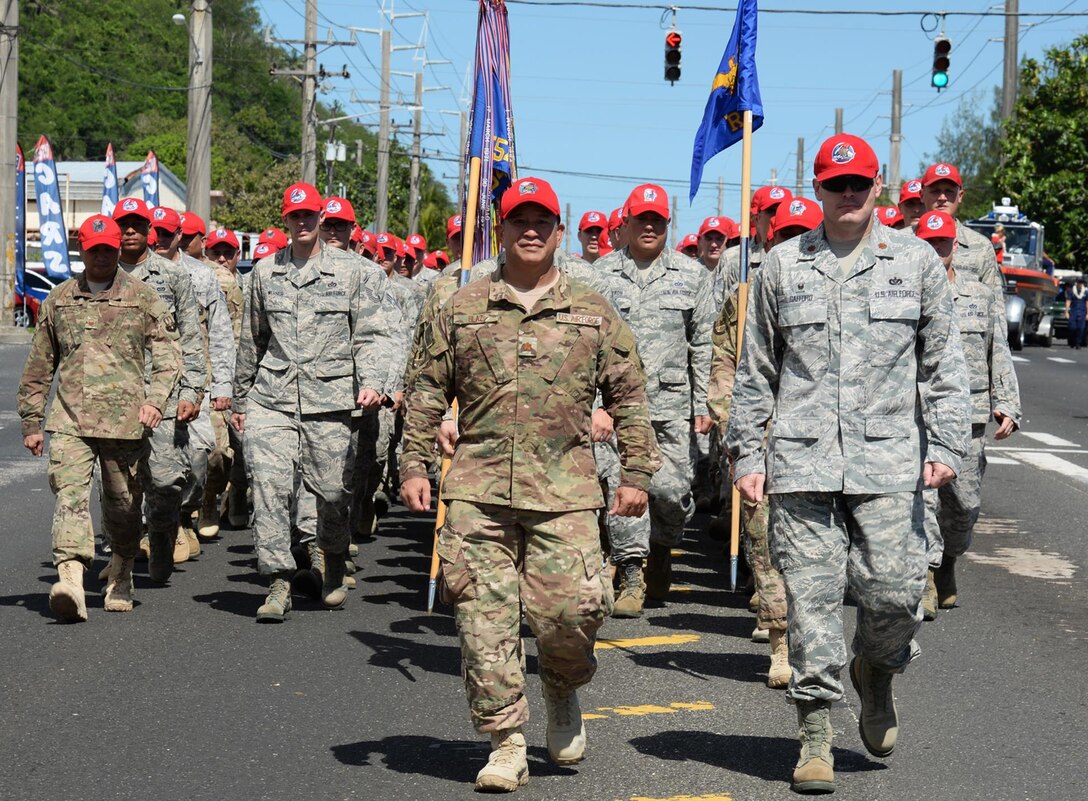 U.S. Airmen with the 554th and 254th Red Horse Squadrons, march in the 72nd Guam Liberation Day parade July 21, 2016, in Hagåtña, Guam. Liberation Day is celebrated to honor the U.S. armed forces who liberated the island from Japanese control. (U.S. Air Force photo by Senior Airman Cierra Presentado/Released)