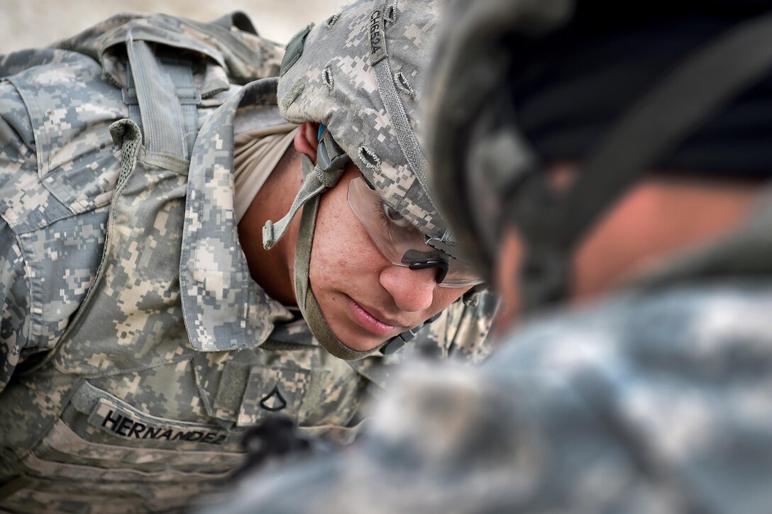 Army Pfc. Camill Hernandez prepares an 81 mm mortar during Arctic Anvil 2016 in the Yukon training area near Fort Wainwright, Alaska, July 23, 2016. Hernandez is assigned to the 25th Infantry Division’s 1st Stryker Brigade Combat Team, Alaska. Air Force photo by Justin Connaher