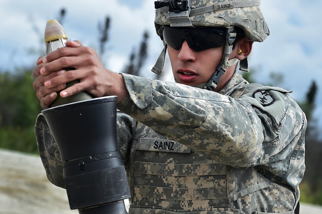 Army Pfc. Pedro Sainz prepares to fire an 81 mm mortar during Arctic Anvil 2016 in the Yukon training area near Fort Wainwright, Alaska, July 23, 2016. Sainz is assigned to the 25th Infantry Division’s 1st Stryker Brigade Combat Team, Alaska. Air Force photo by Justin Connaher 