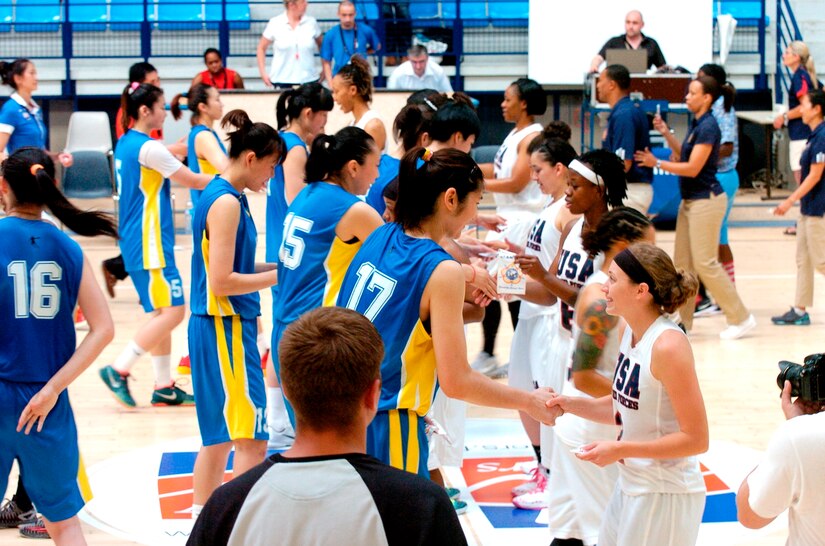 USA and China exchange mementos prior to their game during the 1st CISM World Women's Military Basketball Championship held in Angers, France from 28 June to 5 July 2015.  In this match, China defeated the U.S. in a close game 79-74.  China would finish in second place overall with the U.S. capturing the bronze medal.  
