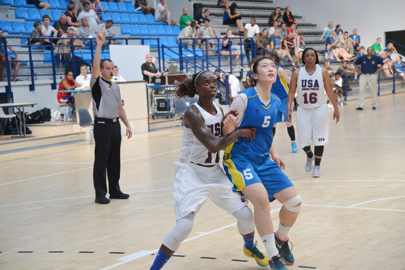 Army Sgt. Kimberly Smith (left) fights for the rebound of the matchup between USA during the 1st CISM World Women's Military Basketball Championship held in Angers, France from
28 June to 5 July 2015.  In this match, China defeated the U.S. in a close game 79-74.  China would finish in second place overall with the U.S. capturing the bronze medal.  
