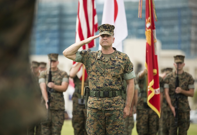 U.S. Marine Corps Col. Robert V. Boucher, outgoing commanding officer of Marine Corps Air Station Iwakuni, Japan, renders a salute during his change of command ceremony at MCAS Iwakuni, July 22, 2016. Residents, locals and guests gathered aboard MCAS Iwakuni to witness U.S. Marines and sailors welcome Col. Richard Fuerst as their new commanding officer. (U.S. Marine Corps photo by Lance Cpl. Donato Maffin)