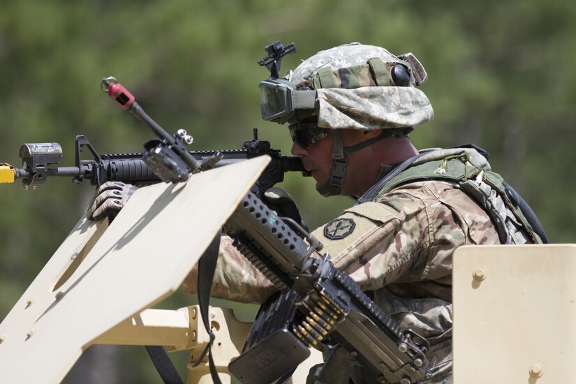 FORT MCCOY, Wis.—U.S Army Reserve Sgt. Michael Schreckengost, a team leader from the 320th Military Police Company, St. Petersburg, Fla. aims his weapon from the turret of a Humvee during a mass casualty scenario during Warrior Exercise 2016 at Fort McCoy, Wis. More than 92 units from across the U.S Army Reserve, Army National Guard and Active Army are participating in WAREX, the 84th Training Command's third and final Warrior Exercise of the year, hosted by the 86th Training Division. (U.S Army Photo by Sgt. Devin M. Wood) 