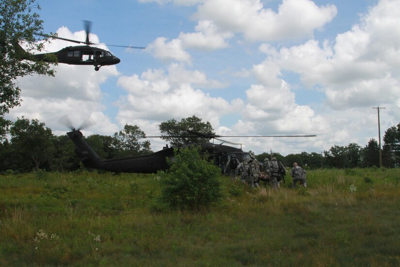 FORT MCCOY, Wis.--Soldiers from the 344th MP Company, Clearwater Fla. load wounded Soldiers onto a UH-60 Blackhawk helicopter during a mass casulaty scenario during Warrior Exercise 86-16-03. More than 92 units from across the U.S Army Reserve, Army National Guard and Active Army are participating in the 84th Training Command's third and final Warrior Exercise of the year. WAREX 86-16-03, hosted by the 86th Training Division.  (U.S Army Photo by Sgt. Devin M. Wood)