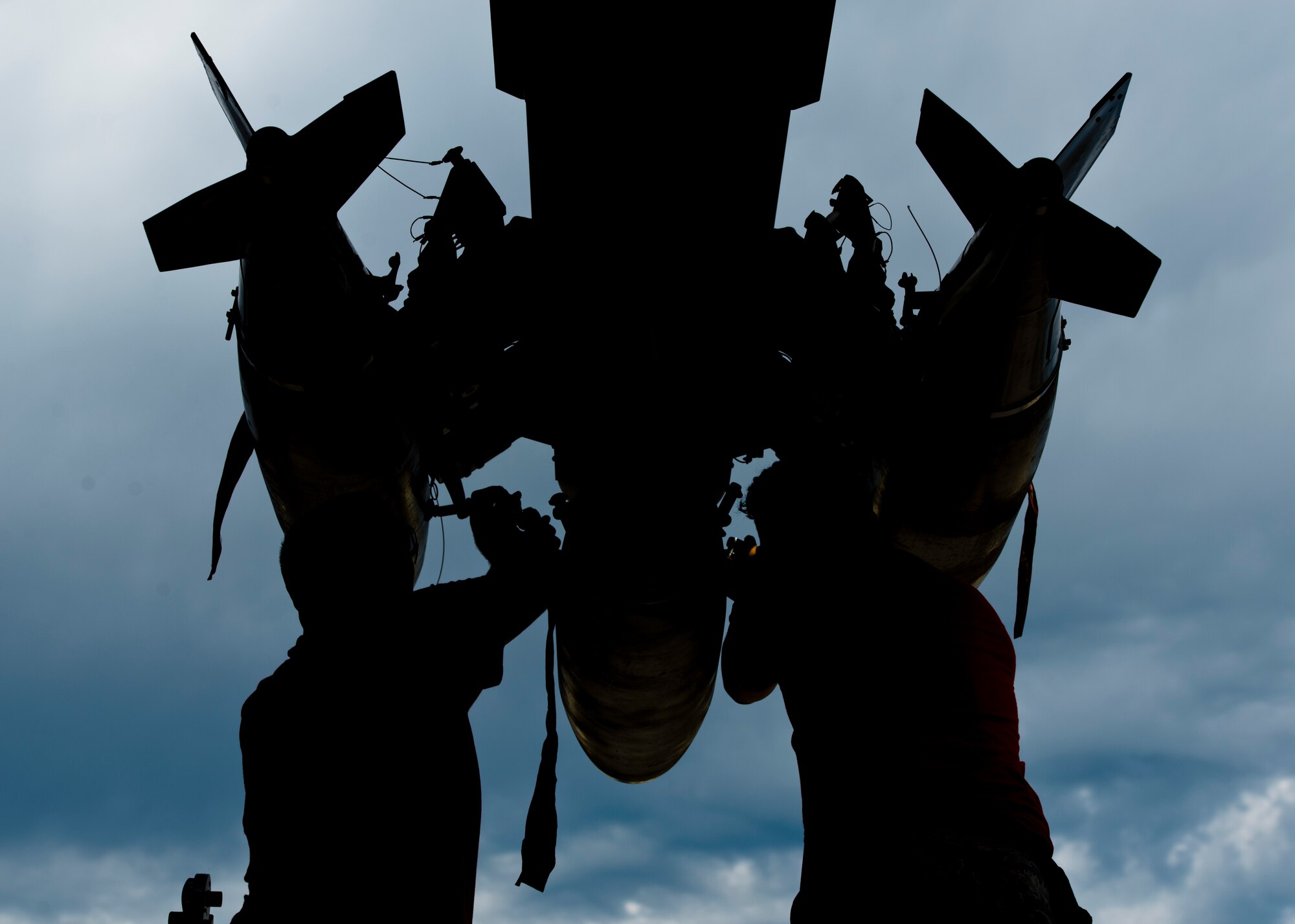 Airmen from the 23rd Aircraft Maintenance Unit load crew attach the final inert munition during the Load Crew of the Quarter competition at Dock 7 at Minot Air Force Base, N.D., July 22, 2016. The competition was comprised of four parts: dress and appearance, a loader’s knowledge test, toolbox inspection and the timed bomb load. (U.S. Air Force photo/Airman 1st Class J.T. Armstrong)