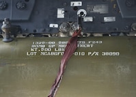 An inert bomb rests on the bomb rack of a B-52H Stratofortress at Dock 7 at Minot Air Force Base, N.D., July 22, 2016. The competition was comprised of four parts: dress and appearance, a loader’s knowledge test, toolbox inspection and the timed bomb load. (U.S. Air Force photo/Airman 1st Class J.T. Armstrong)