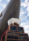 The Load Crew Competition trophy sits under a B-52H Stratofortress at Dock 7 at Minot Air Force Base, N.D., July 22, 2016. The competition was comprised of four parts: dress and appearance, a loader’s knowledge test, toolbox inspection and the timed bomb load. (U.S. Air Force photo/Airman 1st Class J.T. Armstrong)