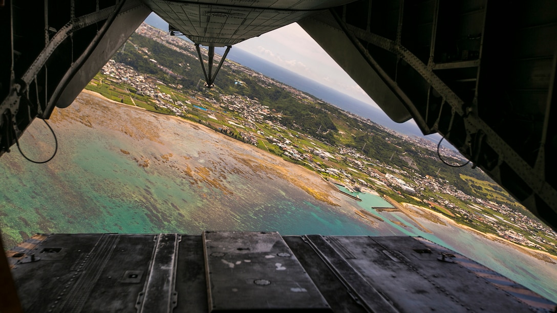 A CH-53E Super Stallion flies over Naha city July 22, 2016, in Okinawa, Japan. Marines with Marine Heavy Helicopter Squadron 361, 3rd Marine Aircraft Wing currently deployed with 1st Marine Aircraft Wing as part of the unit deployment program, worked alongside the Japan Self-Defense Force and Okinawa emergency services in Chura-Shima Rescue 2016. The annual exercise hosted by the 15th Brigade, Western Army, Japan Ground Self-Defense Force, trains humanitarian assistance and disaster relief-involved agencies for a swift reaction to a large-scale earthquake and tsunami in Okinawa