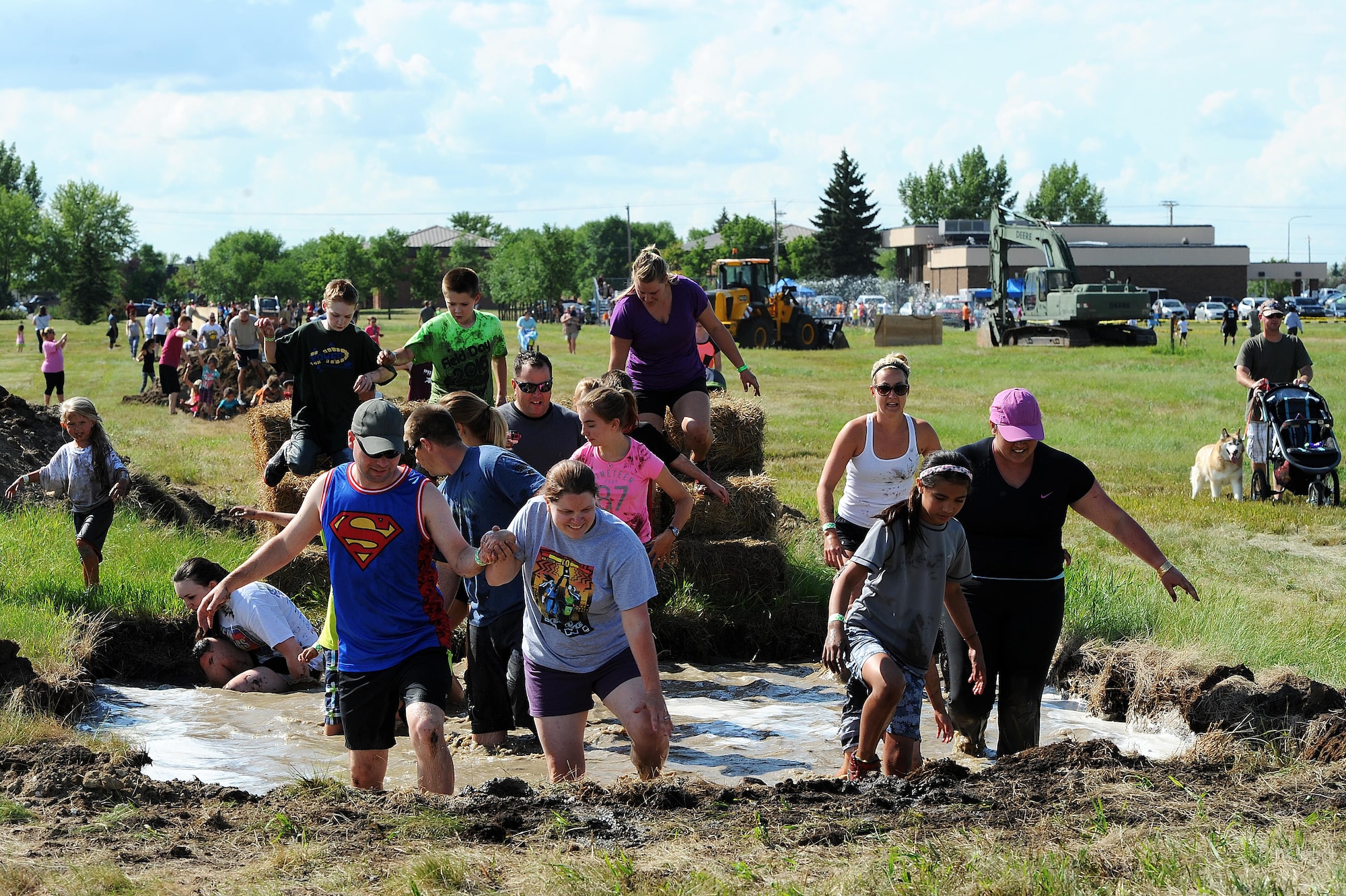 Members of Team Minot participate in the 2016 Mini Mudder, July 15, 2016 at Minot Air Force Base, N.D. Approximately 900 Airmen and their families attend the event, which lasted 2 hours. (U.S. Air Force photo/Senior Airman Kristoffer Kaubisch)