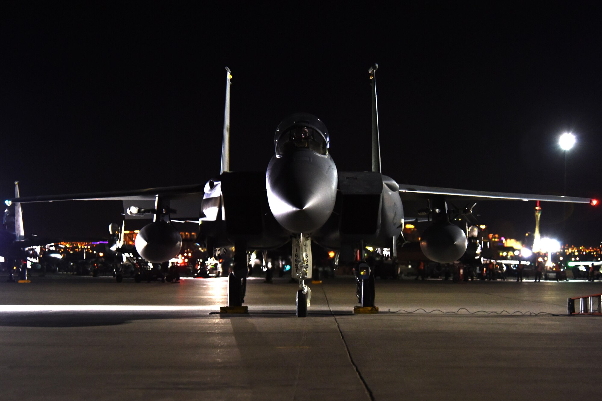 Lt. Col. Lucas Teel, 336th Fighter Squadron commander, readies an F-15E Strike Eagle for a mission during Red Flag 16-2, March 9, 2016, at Nellis Air Force Base, Nevada. Teel and other Strike Eagle aircrew and maintainers participated in the two-week, large-force exercise to enhance warfighting skills along with joint and allied interoperability. (U.S. Air Force photo/Staff Sgt. Chuck Broadway)