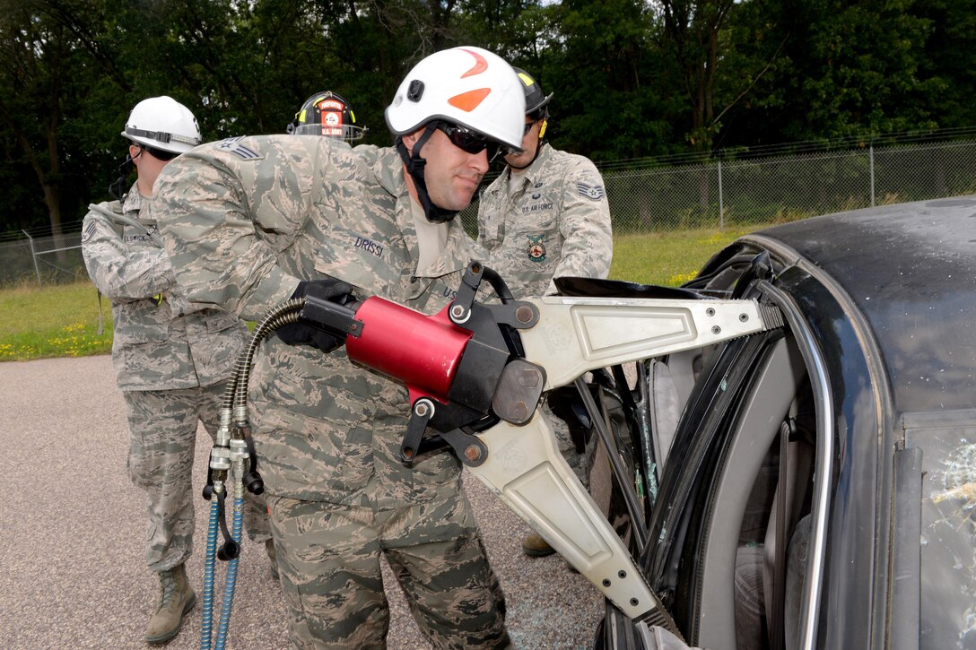 Air Force Senior Airman Hassen Drissi prepares to practice using hydraulic tools during vehicle extrication training as part of Patriot North 16 at Volk Field, Wis., July 16, 2016. Drissi is a firefighter assigned to the Illinois Air National Guard’s 182nd Civil Engineer Squadron. Air National Guard photo by Senior Master Sgt. David H. Lipp