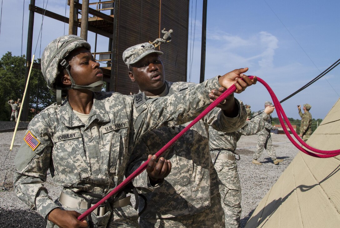 Task Force Wolf, Army Reserve instructors from Alpha Company, 399th Training Support Battalion (ROTC), assists Cadet Initial Entry Training (CIET) candidates in rappeling the Slant Wall Gold during Cadet Summer Training (CST16), at Ft. Knox, Kentucky, July 23. (U.S. Army Reserve photo by Sgt. Karen Sampson/ Released)