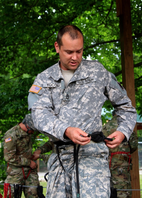 Task Force Wolf, Army Reserve instructor Sgt. 1st Class Kevin Yocum from Bravo Company, 399th Training Support Battalion (ROTC), teaches Cadet Initial Entry Training (CIET) candidates how to tie a proper swiss seat in the rope corral during Cadet Summer Training (CST16), at Ft. Knox, Kentucky, June 23. (U.S. Army Reserve photo by Sgt. Karen Sampson/ Released)