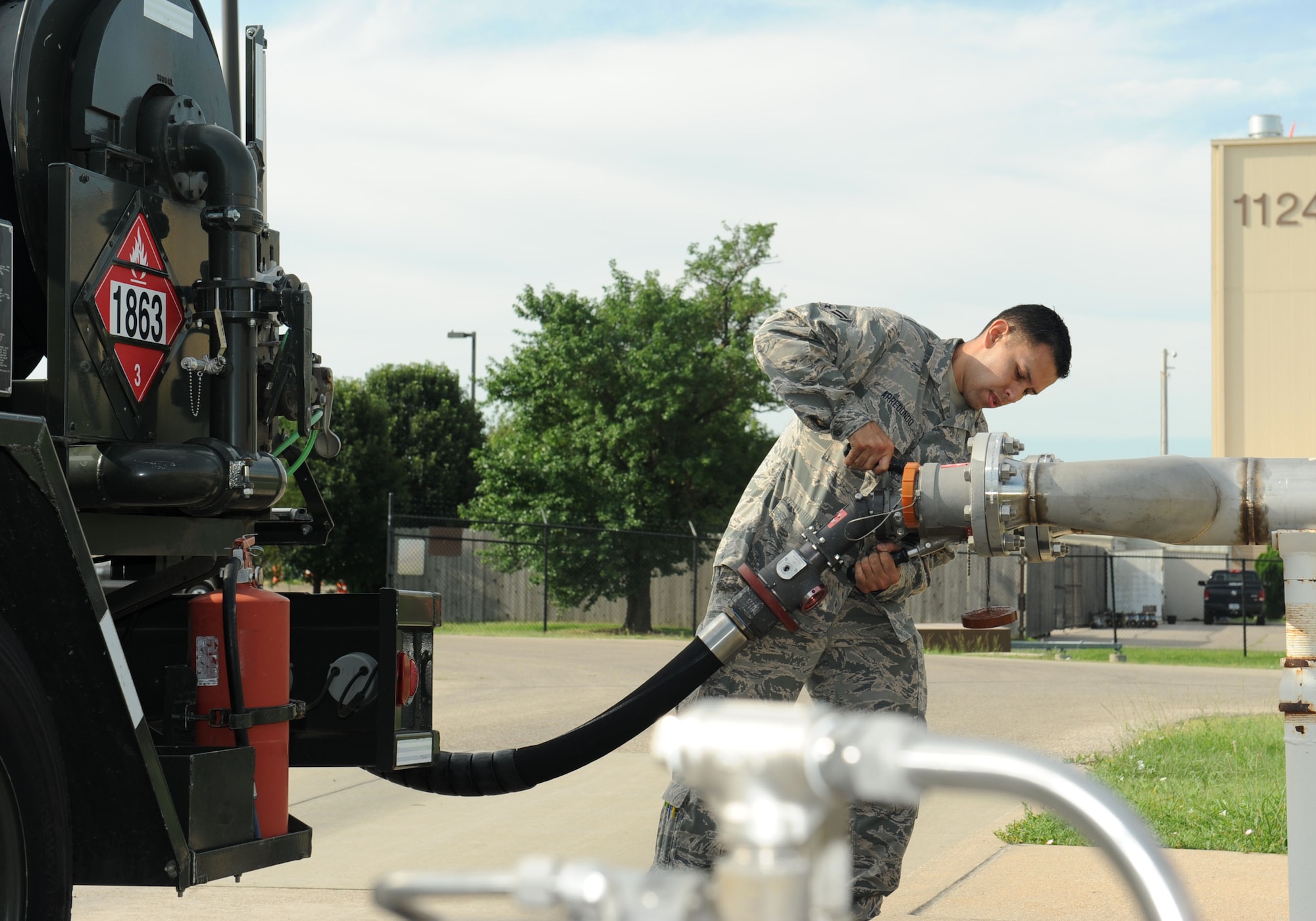 Airman 1st Class Jose Arredondo, 22nd Logistics Readiness Squadron petroleum, oils and lubricants apprentice, connects a fuel hose to a hydrant, July 19, 2016, at McConnell Air Force Base, Kan. This test needs to be done daily to ensure the fuel being transferred to KC-135 Stratotanker aircraft is clean and serviceable. (U.S. Air Force photo/Senior Airman David Bernal Del Agua)