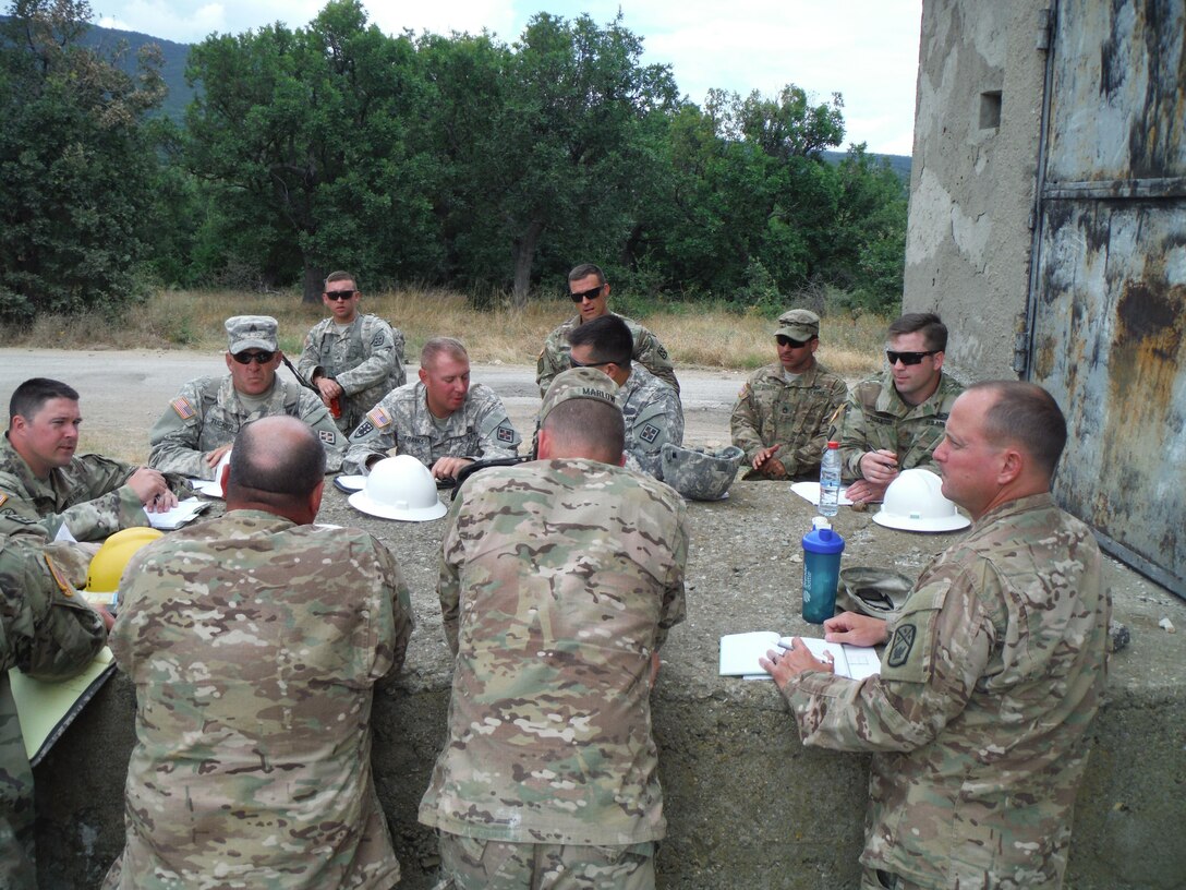 Members of the 841st Engineer Battalion, U.S. Army Reserve conduct a construction update brief for the 194th Engineer Brigade, Tennessee Army National Guard at Novo Selo Training Area, Bulgaria as part of Operation Resolute Castle 16, July 20, 2016. (U.S. Army photo by Capt. Jose F. Lopez Jr., 841st Eng. Bn., United States Army Reserve)