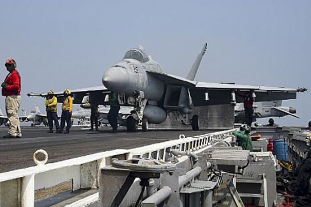 An F/A-18E Super Hornet prepares to launch from the aircraft carrier USS Dwight D. Eisenhower in the Arabian Gulf, July 22, 2016. The carrier and its strike group are deployed in support of Operation Inherent Resolve in the U.S. 5th Fleet area of operations. Navy photo by Mass Communication Specialist 3rd Class Bobby Baldock
