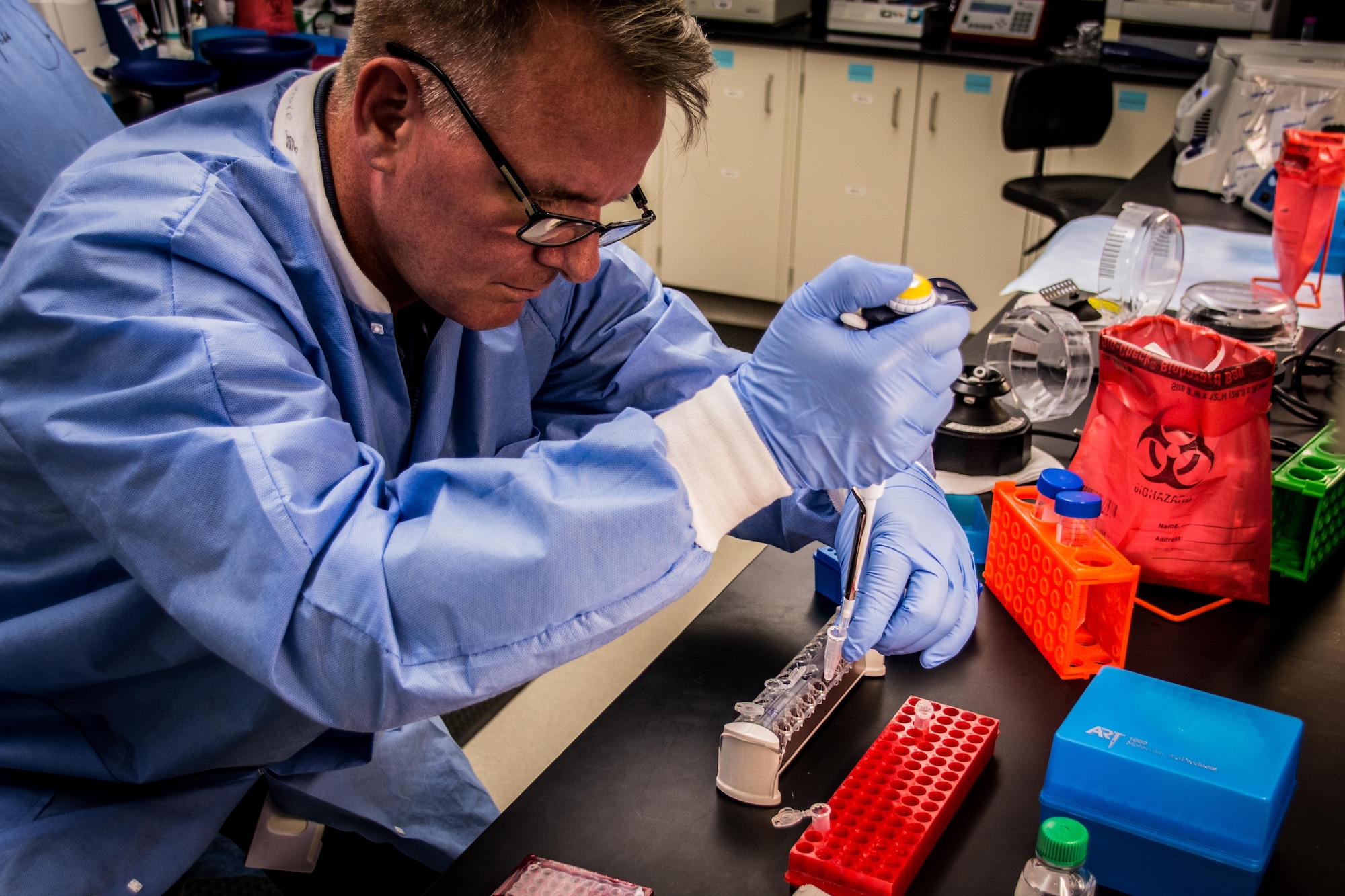 John Trombley, a biomedical lab technician at the U.S. Air Force School of Aerospace Medicine, works on exome sequencing to observe gene expression under hypoxic conditions for Air Force personnel. Gene expression can dramatically change to cope with environmental stressors. Efforts are underway to determine what genes are either up or down regulated under hypoxic conditions experienced by flight personnel. (U.S. Air Force photo/Richard Eldridge)