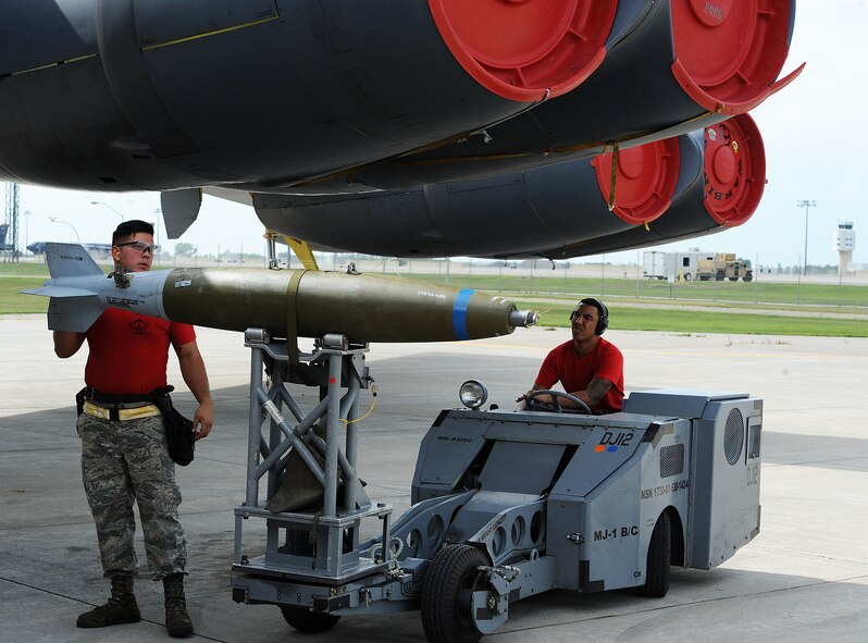 The 23rd Aircraft Maintenance Unit load crew use a MHU-83 “Jammer” to move an inert munition during the Load Crew of the Quarter competition at Dock 7 at Minot Air Force Base, N.D., July 22, 2016. Two weapons load crews, representing the 23rd Bomb Squadron, were timed on their ability to load three inert munitions onto a B-52H Stratofortress. (U.S. Air Force photo/Senior Airman Kristoffer Kaubisch)