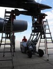 The 23rd Aircraft Maintenance Unit load crew use a MHU-83 “Jammer” to move an inert munition during the Load Crew of the Quarter competition at Dock 7 at Minot Air Force Base, N.D., July 22, 2016. Two weapons load crews, representing the 23rd Bomb Squadron, were timed on their ability to load three inert munitions onto a B-52H Stratofortress. (U.S. Air Force photo/Senior Airman Kristoffer Kaubisch)