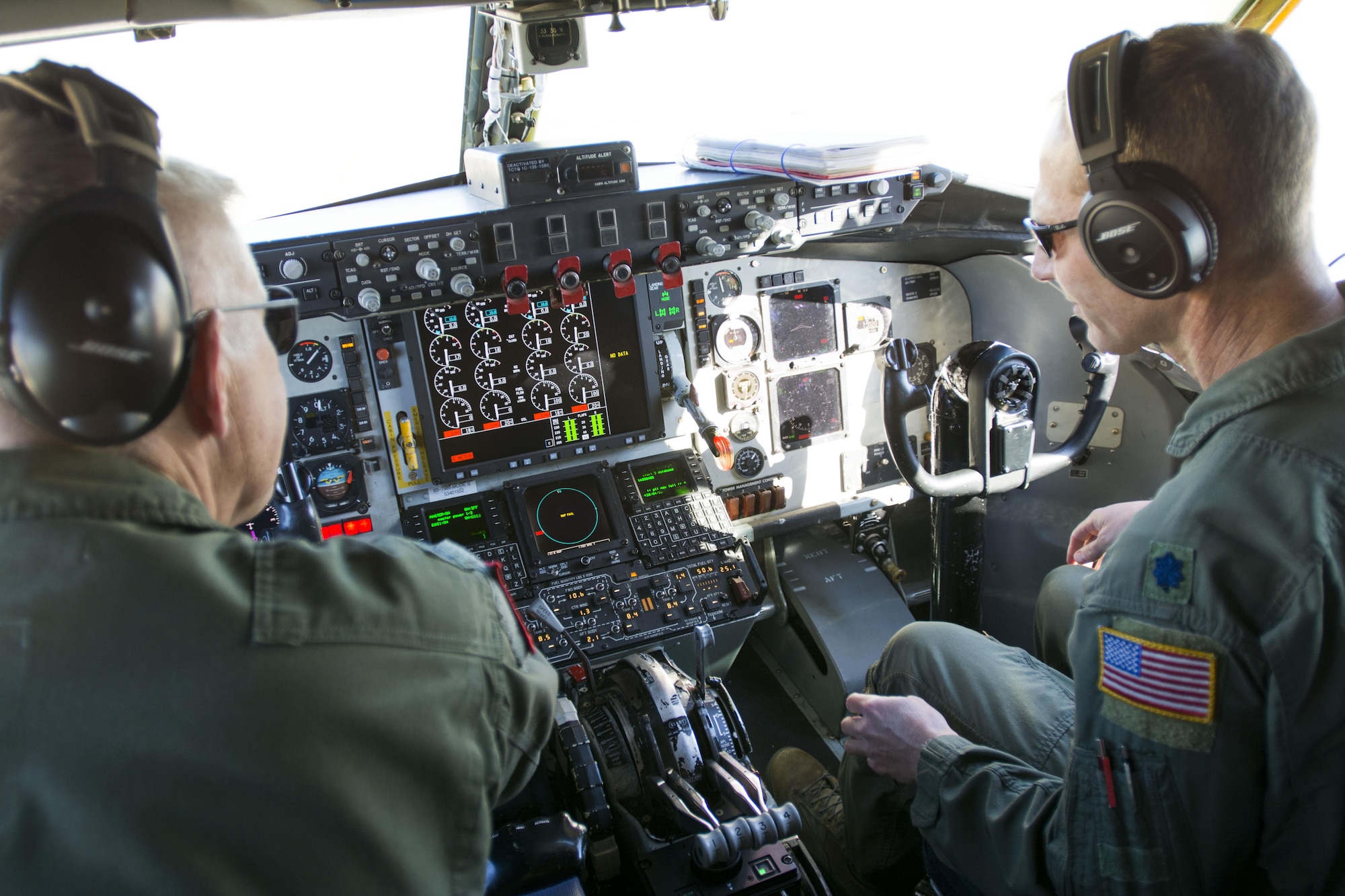 Lt. Col. Eric Wilks (left) and Lt. Col. Marvin Ashbaker, pilots with the 465th Air Refueling Squadron at Tinker Air Force Base, Oklahoma, conduct pre-flight checks aboard the Air Force Reserve Command's first KC-135 Stratotanker to receive the Block 45 upgrade. The upgrade provides a digital display of engine controls, an updated autopilot, a new altimeter and software improvements, all of which will help ensure the KC-135 can perform well into the future as the workhorse of the air refueling fleet. (Tech. Sgt. Lauren Gleason)