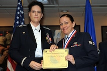 U.S. Air Force Reserve Lt. Col. Rosalind Abdulkhalick, 913th Force Support Squadron commander, poses for a photo with Senior Airman Rachel Clark, a personnel specialist assigned to the 913 FSS, during the Airman Leadership School graduation ceremony at Little Rock Air Force base, Ark., July 21, 2016. Clark and fellow graduate Senior Airman Fanise Jefferson, will soon become the 913th Airlift Group’s newest noncommissioned officers. (U.S. Air Force photo by Senior Airman Harry Brexel)