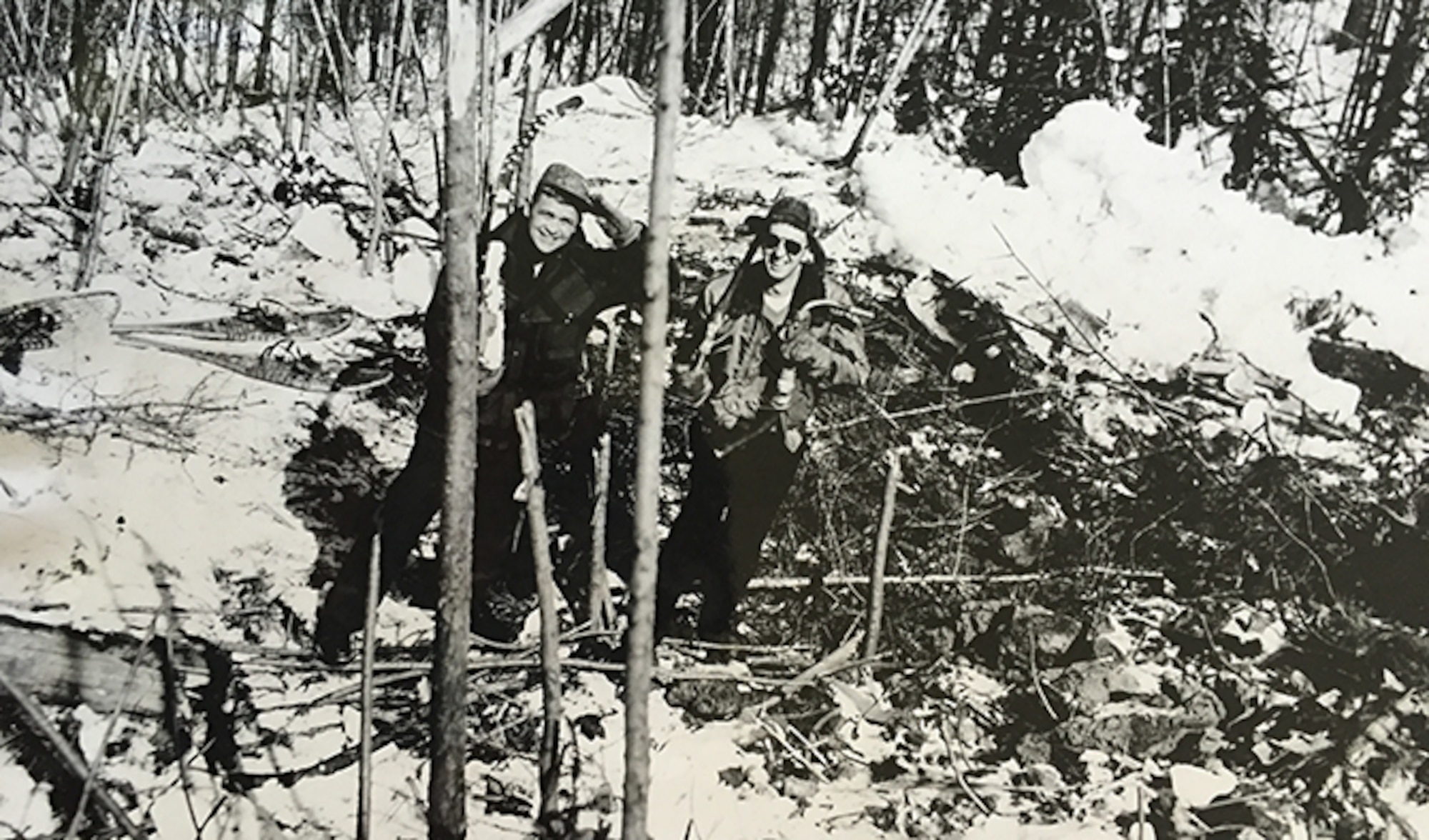 Lt. Hal Morrill poses with Lt. Dallas Sartz within the impact crater of the F-86 Sabre crash, days after the crash. Due to the terrain of the crash site, the Washington National Guard was never able to remove the wreckage. (Courtesy Photo)