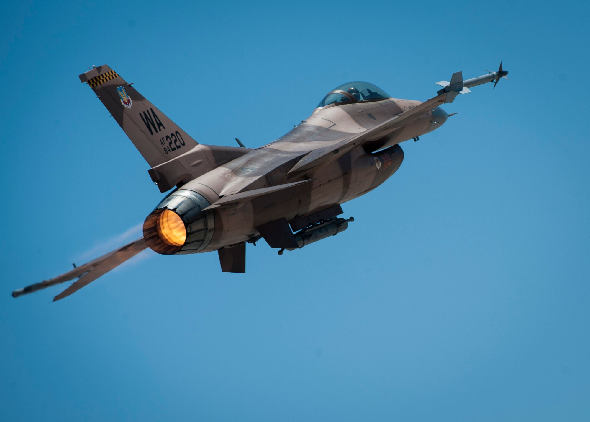 An F-16C from the 64th Aggressors Squadron, Nellis Air Force Base, Nev., banks off towards the Nevada Test and Training Range to participate in a training sortie during Red Flag 16-3, July 19, 2016. During Red Flag, the 64th AGRS will test other unit’s capabilities in air-to-air combat while acting as the “enemy” in the exercise. (U.S. Air Force photo by Senior Airman Jake Carter/Released)