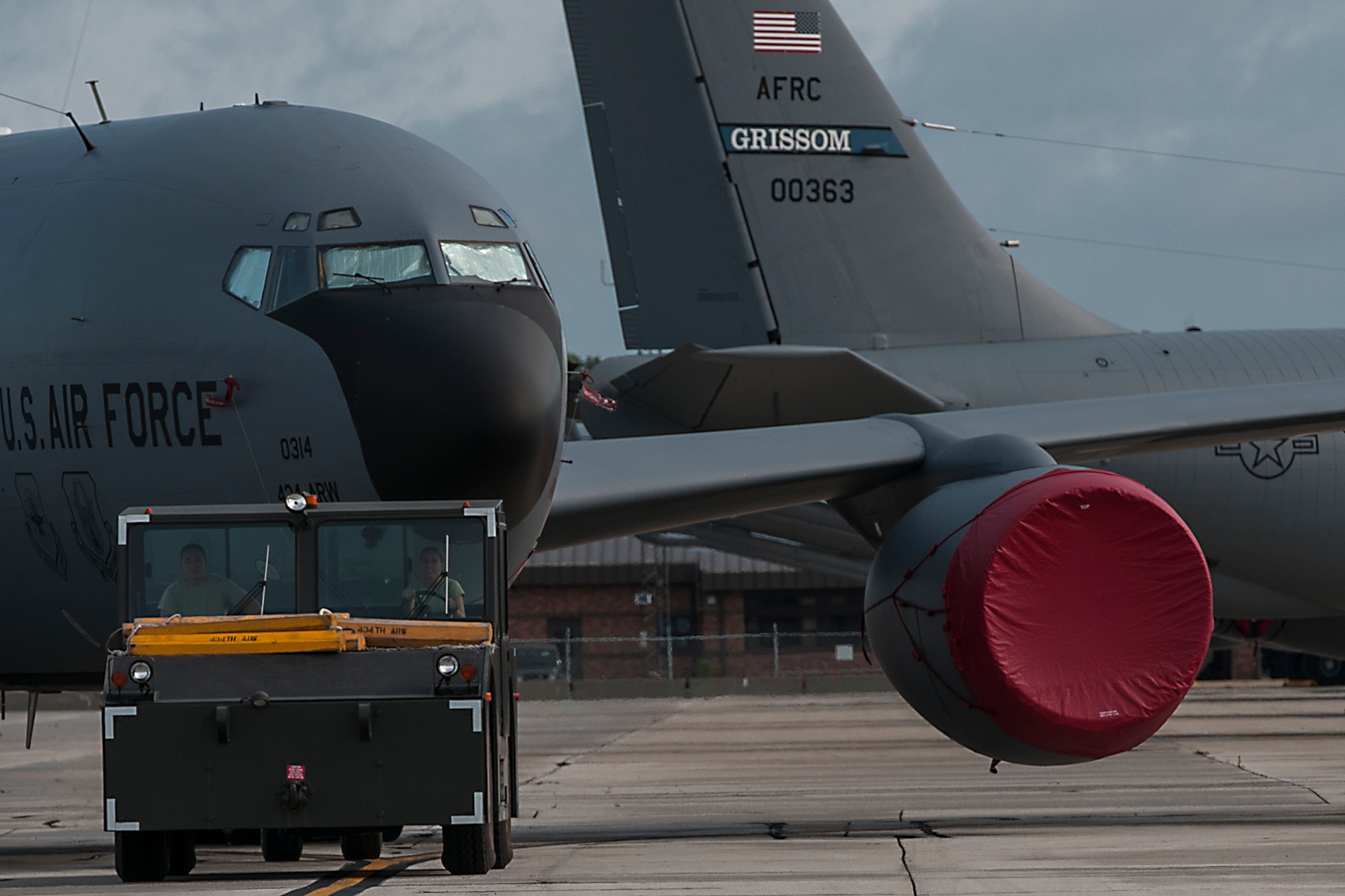 A KC-135R Stratotanker is towed across Grissom Air Reserve Base’s flightline on July 18, 2016. Towing an aircraft requires a minimum of three people -- vehicle operator, a brake operator and a supervisor and in some cases requires a tail walker and two wing walkers. (U.S. Air Force photo/Senior Airman Dakota Bergl) 