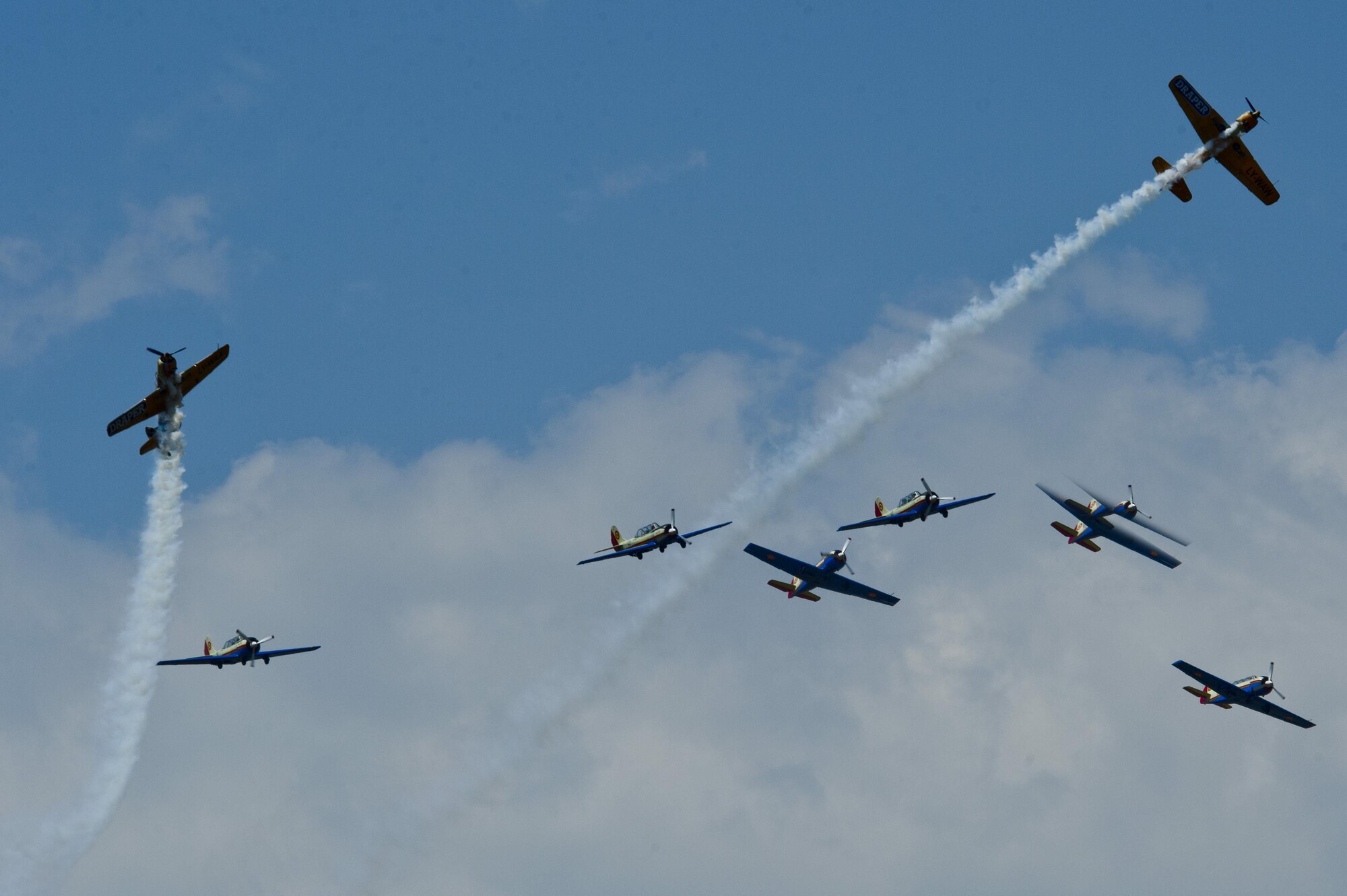 Several acrobatic aircraft belonging to the Boboiacii de la Bobocul and Iacarii Acrobati organizations fly over the flightline during the Romanian air force's 71st Air Base's air show and open house at Campia Turzii, Romania, July 23, 2016. The aviation demonstration took place during the middle of the U.S. Air Force's 194th Expeditionary Fighter Squadron's six-month long theater security package deployment to Europe in support of Operation Atlantic Resolve, which aims to bolster the U.S.'s continued commitment to the collective security of NATO and dedication to the enduring peace and stability in the region. The unit, comprised of more than 200 CANG Airmen from the 144th Fighter Wing at Fresno ANG Base, Calif., as well as U.S. Air Force Airmen from the 52nd Fighter Wing at Spangdahlem Air Base, Germany, piloted, maintained and supported the deployment of 12 F-15Cs Eagle fighter aircraft throughout nations like Romania, Iceland, the United Kingdom, the Netherlands, Estonia and among others. The F-15Cs took to the skies alongside the 71st AB's MiG-21 fighter aircraft and Puma helicopters for both the airshow, the second engagement of its kind at Campia Turzii under Operation Atlantic Resolve, and the bilateral flight training, also known as Dacian Eagle 2016. (U.S. Air Force photo by Staff Sgt. Joe W. McFadden/Released)