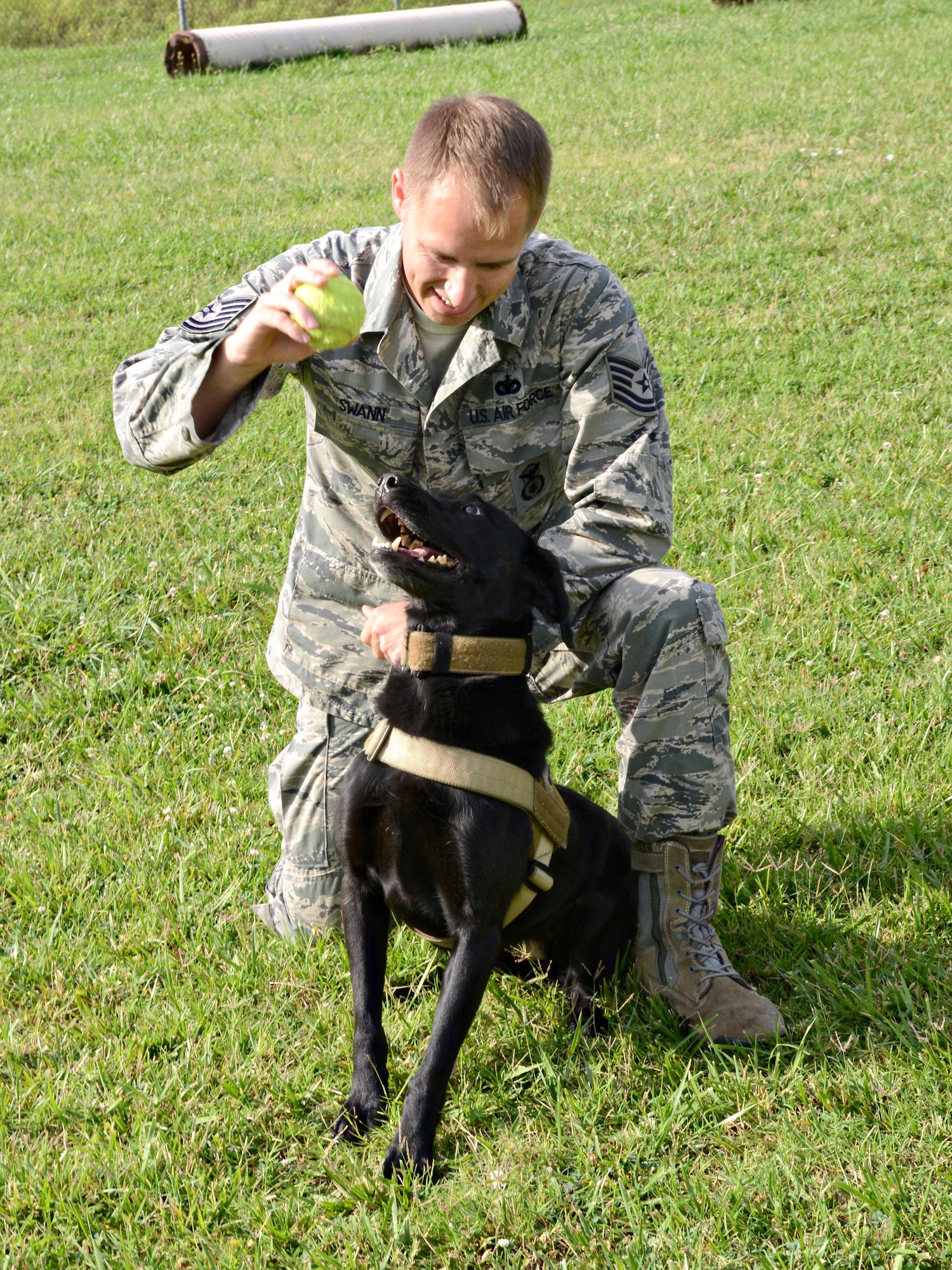 Tech. Sgt. James Swann, the 72nd Security Forces Squadron’s kennel master, plays with Military Working Dog Ritz, before a training session. Sergeant Swann’s responsibilities as kennel master include training and certification of the MWDs and handlers, among other duties, as well as being a handler to Ritz.