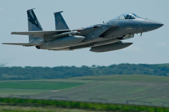 A California Air National Guard F-15C Eagle assigned to the 194th Expeditionary Fighter Squadron, flies over the flightline at Campia Turzii, Romania, July 23, 2016, during the Romanian Air Force's 71st Air Base's air show and open house. The aviation demonstration took place during the middle of the 194th EFS' six-monthslong theater security package deployment to Europe in support of Operation Atlantic Resolve. (U.S. Air Force photo/Staff Sgt. Joe W. McFadden)
