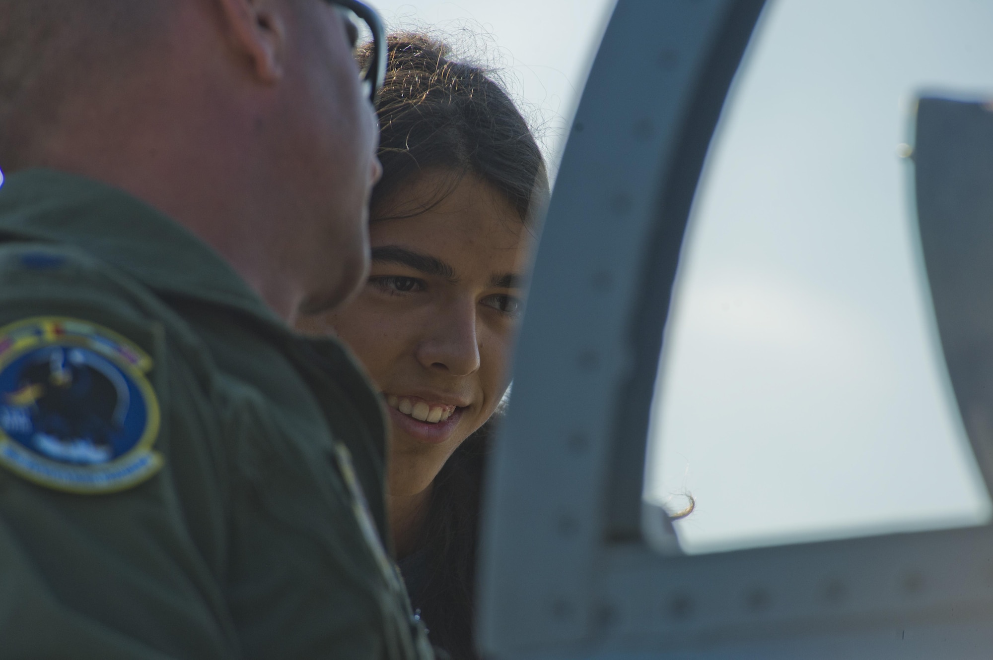 Bogdan Mosutiu, 16, looks inside the cockpit of an F-15C Eagle fighter aircraft as California Air National Guard Lt. Col. Seth Nehring, a 194th Expeditionary Fighter Squadron F-15C pilot, explains more about the aircraft to him during the Romanian air force's 71st Air Base's air show and open house at Campia Turzii, Romania, July 23, 2016. The aviation demonstration took place during the middle of the 194th EFS' six-month long theater security package deployment to Europe in support of Operation Atlantic Resolve, which aims to bolster the U.S.'s continued commitment to the collective security of NATO and dedication to the enduring peace and stability in the region. The unit, comprised of more than 200 CANG Airmen from the 144th Fighter Wing at Fresno ANG Base, Calif., as well as U.S. Air Force Airmen from the 52nd Fighter Wing at Spangdahlem Air Base, Germany, piloted, maintained and supported the deployment of 12 F-15Cs Eagle fighter aircraft throughout nations like Romania, Iceland, the United Kingdom, the Netherlands, Estonia and among others. The F-15Cs took to the skies alongside the 71st AB's MiG-21 fighter aircraft and Puma helicopters for both the airshow, the second engagement of its kind at Campia Turzii under Operation Atlantic Resolve, and the bilateral flight training, also known as Dacian Eagle 2016. (U.S. Air Force photo by Staff Sgt. Joe W. McFadden/Released)