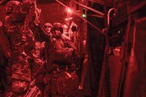 82nd Airborne Division paratroopers perform a nighttime static-line jump from a C-17 Globemaster III aircraft July 17, 2016, over Polk Field, La, as part of Devil Strike, a joint Emergency Deployment Readiness Exercise. For the exercise, Polk Field served as the capital of a fictitious country which had called on the United States for help after getting overrun by hostile forces. (U.S. Air Force photo by Tech. Sgt. Sean Tobin)