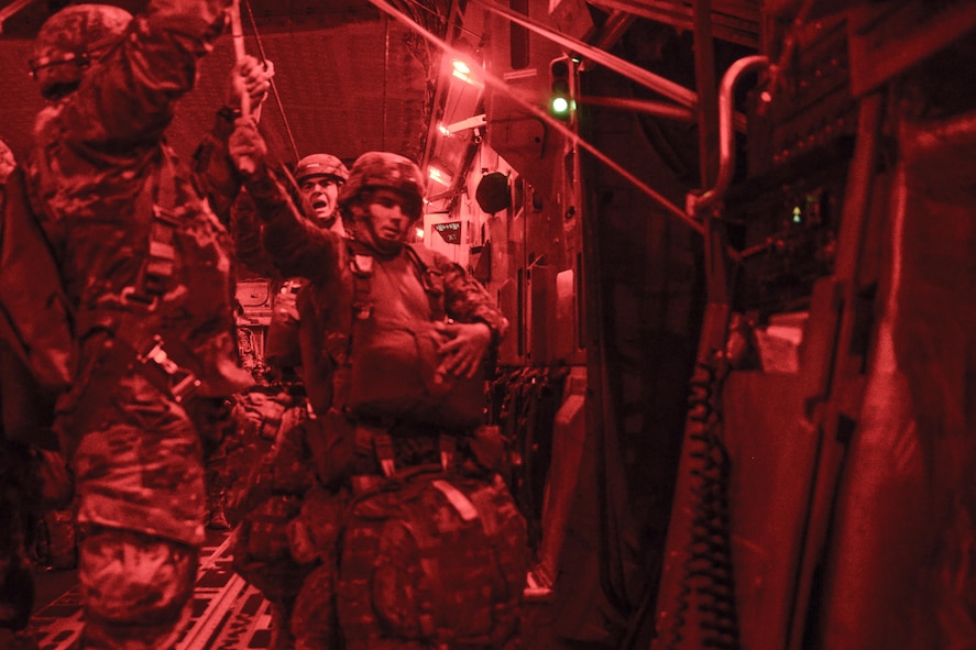 82nd Airborne Division paratroopers perform a nighttime static-line jump from a C-17 Globemaster III aircraft July 17, 2016, over Polk Field, La, as part of Devil Strike, a joint Emergency Deployment Readiness Exercise. For the exercise, Polk Field served as the capital of a fictitious country which had called on the United States for help after getting overrun by hostile forces. (U.S. Air Force photo by Tech. Sgt. Sean Tobin)