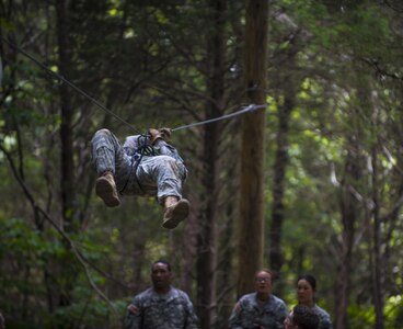 Cadets in Cadet Basic Training at Fort Knox, Ky., attempt to evacuate a simulated casualty across an obstacle at the Leaders Reaction Course, July 23. (U.S. Army photo by Sgt. 1st Class Brian Hamilton/ released)