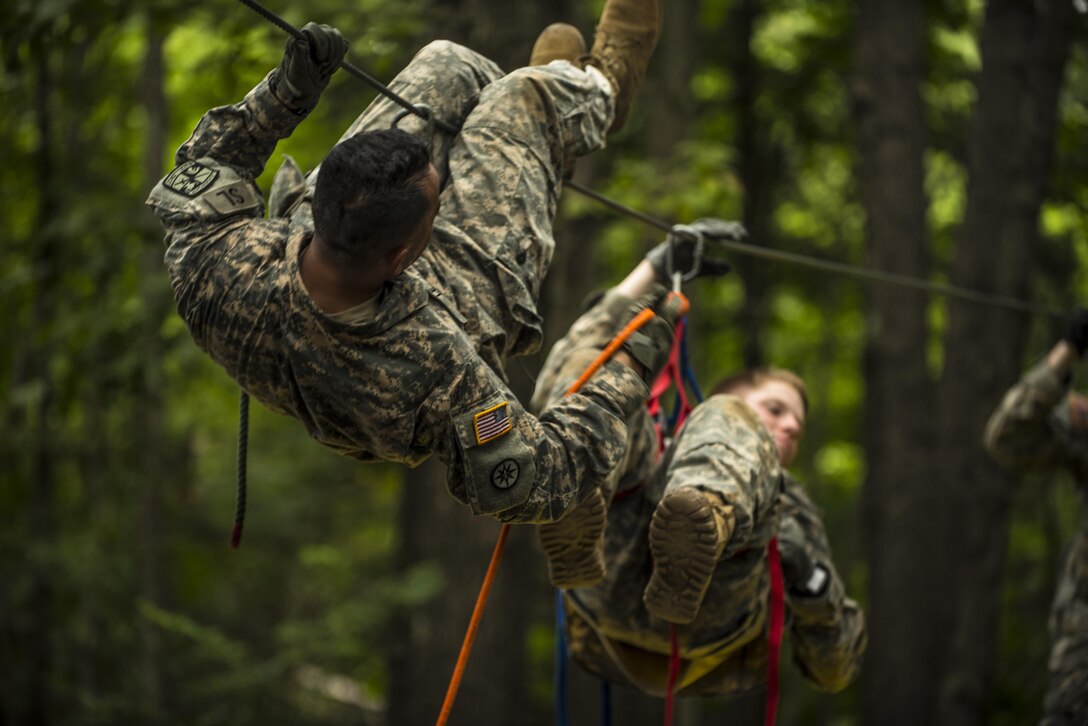 Cadets in Cadet Basic Training at Fort Knox, Ky., attempt to evacuate a simulated casualty across an obstacle at the Leaders Reaction Course, July 23. (U.S. Army photo by Sgt. 1st Class Brian Hamilton/ released)
